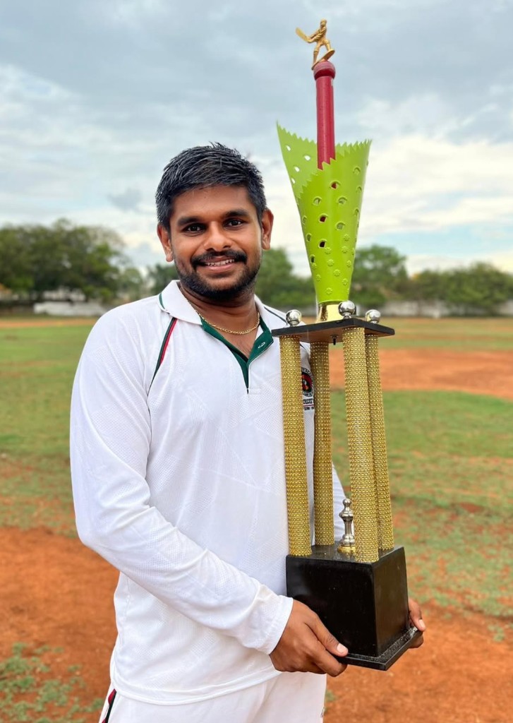 Champion holding tournament trophy